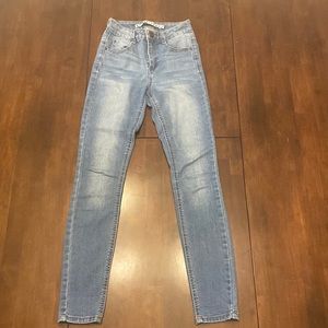 Skinny blue jeans call, lightly worn, and straight leg